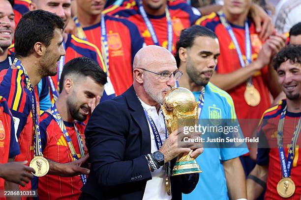 Luis de la Fuente, Head Coach of Spain, kisses the FIFA World Cup Winner’s Trophy after the team’s victory following the FIFA World Cup 2026 Final...