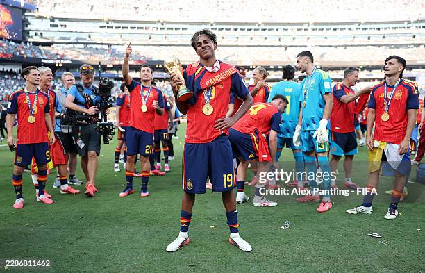 Lamine Yamal of Spain celebrates with the FIFA World Cup Winner’s Trophy after the team’s victory following the FIFA World Cup 2026 Final match...