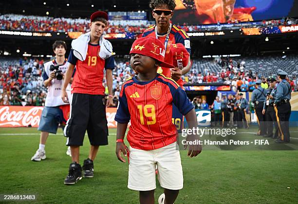 Keyne, the little brother of Lamine Yamal of Spain, celebrates after the team's victory following the FIFA World Cup 2026 Final match between Spain...