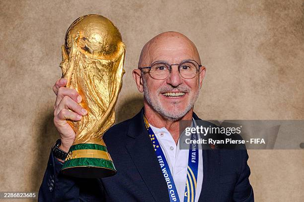 Luis de la Fuente, Head Coach of Spain, poses for a portrait with the FIFA World Cup Winner's Trophy after the FIFA World Cup 2026 Final match...