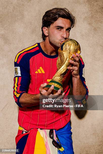 Ferran Torres of Spain poses for a portrait with the FIFA World Cup Winner's Trophy after the FIFA World Cup 2026 Final match between Spain and...