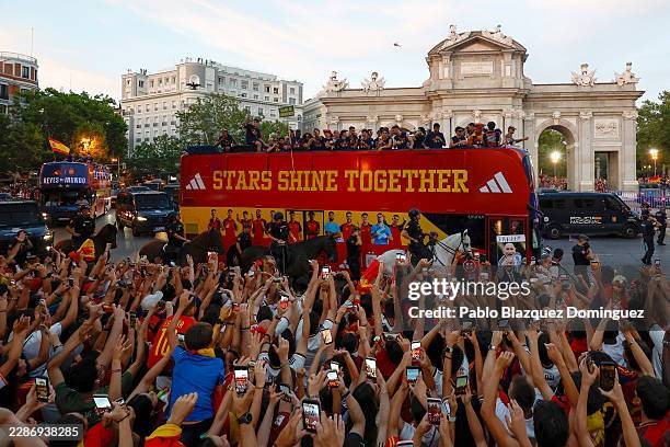 Players of Spain celebrate on the bus as it passes fans during the FIFA World Cup 2026 Trophy parade on July 20, 2026 in Madrid, Spain. The final...
