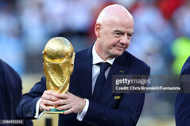 President Gianni Infantino holds the trophy at full-time following the FIFA World Cup 2026 Final match between Spain and Argentina at New York New...