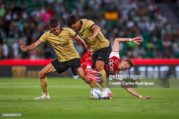 Sergi Altimira of Sporting CP and Pedro Goncalves of Sporting CP tackle Mathys Detourbet of AS Monaco during the Trofeu Cinco Violinos match between...