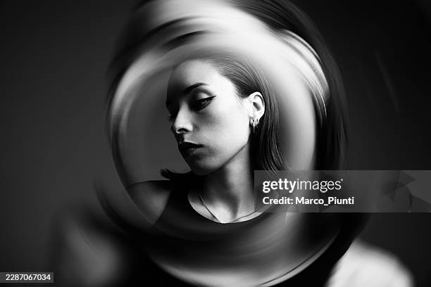 abstract black and white portrait with circular motion blur - emotional series stock pictures, royalty-free photos & images
