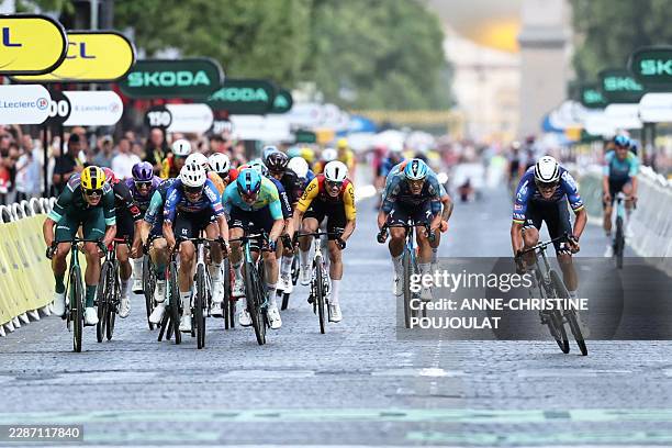 Alpecin - Premier Tech team's Dutch rider Mathieu van der Poel cycles to the finish line to win the 21st stage of the 113th edition of the Tour de...