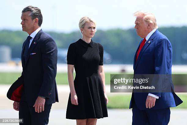 Secretary of War Pete Hegseth, executive assistant to U.S. President Donald Trump Natalie Harp and U.S. President Donald Trump attend a dignified...