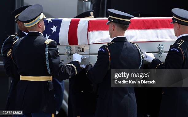 Army carry team transports the flag-draped transfer case containing the remains of Army 1st Lt. Tyler James Feehan during a dignified transfer at...