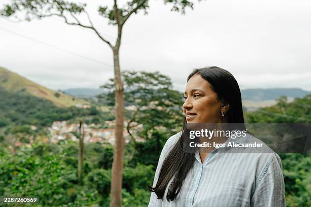 woman contemplating mountain valley - latin music stock pictures, royalty-free photos & images