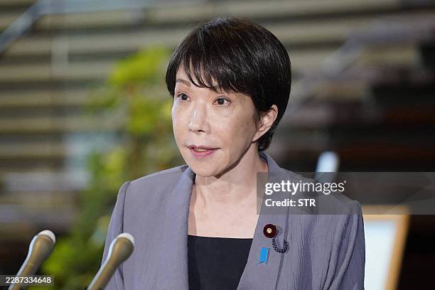 Japanese Prime Minister Sanae Takaichi speaks to the media at the Prime Minister's Office, in Tokyo after a 7.1-magnitude earthquake hit southern...