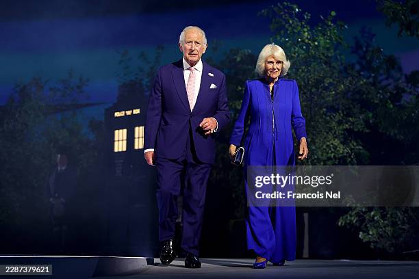 King Charles III and Queen Camilla walk on stage during the opening ceremony ahead of the Glasgow 2026 Commonwealth Games at The Hydro on July 23,...