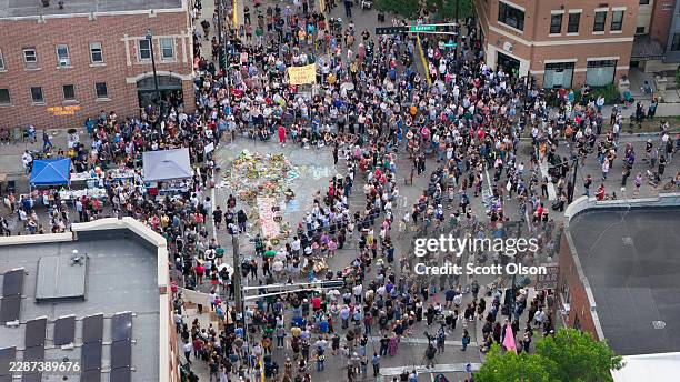In an aerial view, people attend a vigil at the intersection where Corey Ruiz was shot and killed yesterday by a Madison Police officer on July 23 in...