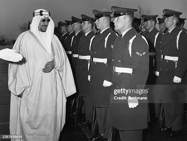 King Saud bin Abdulaziz Al Saud inspecting a US Air Force Honour Guard at the Pentagon in Washington, February 1st 1957. The King was attending a...