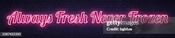 always fresh never frozen - glowing neon text on brick wall background - infinity wall stock illustrations