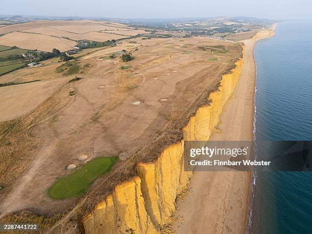 In this aerial view, a golfing green and dried grass is seen at Bridport and West Dorset Golf Club, on July 23, 2026 in West Bay, United Kingdom....