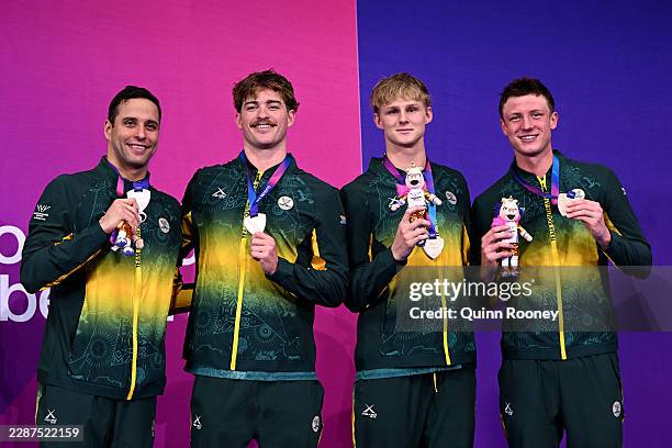 Bronze medalists Pieter Coetze, Guy Brooks, Ruard van Renen and Chad le Clos of Team South Africa pose for a photo during the medal ceremony for the...
