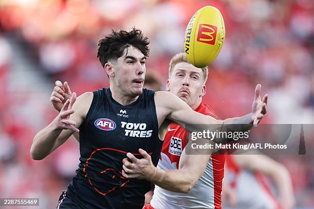 Riley Hamilton of the Giants competes for the ball against Matt Roberts of the Swans during the round 20 AFL match between Greater Western Sydney...