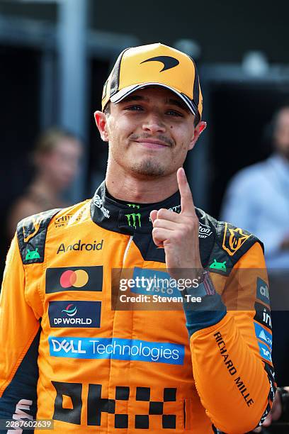 Pole position qualifier Lando Norris of Great Britain and McLaren celebrates in parc ferme during qualifying ahead of the F1 Grand Prix of Hungary at...