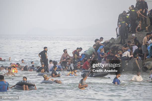 Hundreds of migrants have attempted to swim from Morocco to the Spanish city of Ceuta in North Africa, while the number of arrivals exceeded 1,500 in...