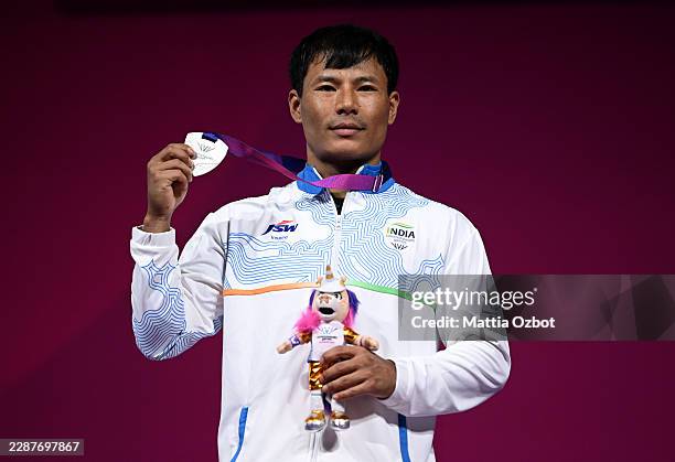 Silver medalist Rishikanta Singh Chanambam of Team India poses for a photo during the Men's 60kg Weightlifting medal ceremony on day three of the...