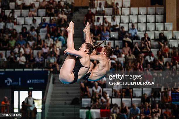 Italy's divers Chiara Pellacani and Italy's diver Matteo Santoro compete in the mixed team diving final of the LEN European Aquatics Championships at...