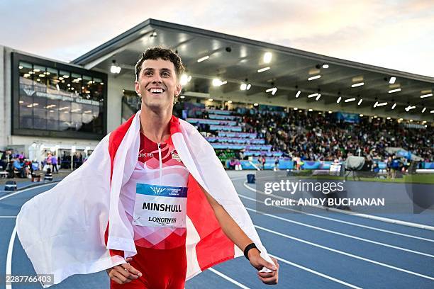 Second-placed England's Jake Minshull celebrates after competing in the men's 400m hurdles final during the athletics event at the Scotstoun Stadium...