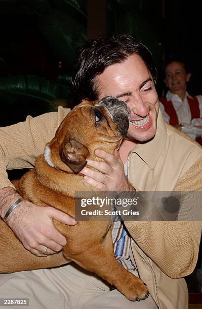 Alan Cumming with "Bubbles" the English Bulldog during a party to celebrate the New Yorkers for Children's "Back To School Program" at Dunhill's in...