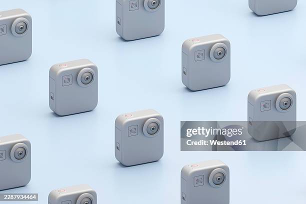 3d render of a compact action camera pattern on blue background - gray studio background stock illustrations