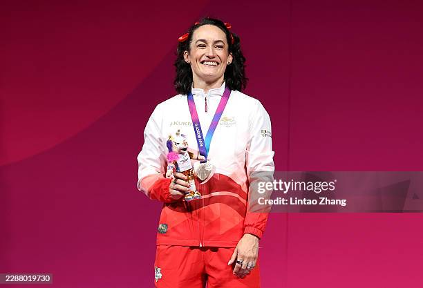 Silver medalist Sarah Davies Smale of Team England celebrates on the podium during the medal ceremony for the Women's 63kg Weightlifting on day five...