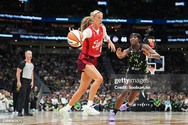 Sophie Cunningham of the Indiana Fever handles the ball against Flau'jae Johnson of the Seattle Storm during the first half at Climate Pledge Arena...