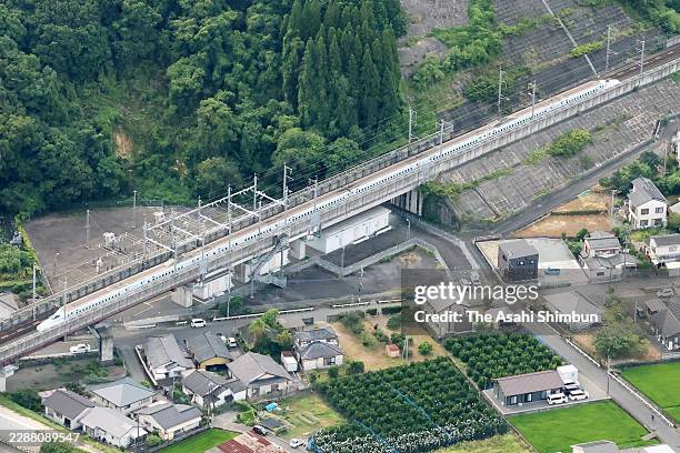In this aerial image, a Kyushu Shinkansen bullet train remains after the service is suspended a day after a strong earthquake on July 29, 2026 in...