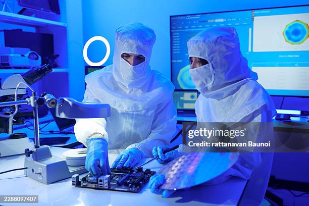 technician working on analyzing semiconductor or microchip boards, electronics industry, electronic engineer, computer technology, cpu maintenance, hardware, motherboard component upgrades. - computer engineer lab stock pictures, royalty-free photos & images