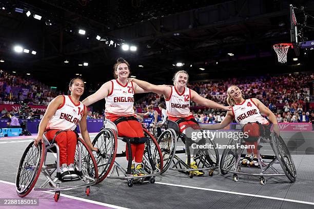 Gold medalists Joy Haizelden, Jade Atkin, Lucy Robinson and Charlotte Moore of Team England pose for a photo after victory in the Wheelchair Women's...