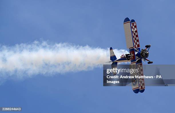 Year-old Betty Bromage on the wing of an Aero-Super-Batics biplane during an attempt to break the Guinness World Record for the oldest female...