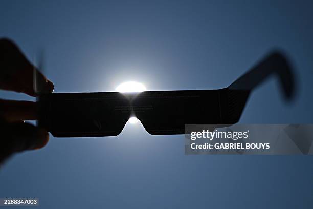 This photograph shows eclipse-viewing glasses for direct observation of the sun in Beziers, Southern France, on August 5 ahead of the August 12 solar...