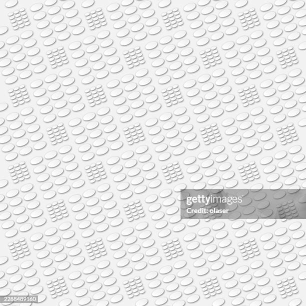 white embossed circular patterns repeat across a clean, textured surface with soft shadows and a subtle diagonal arrangement. - gray matte background stock illustrations