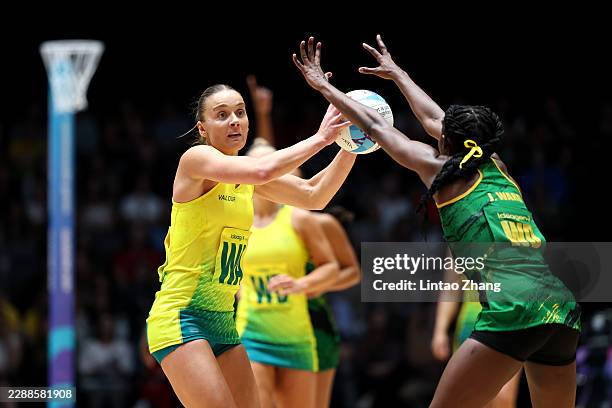 Liz Watson of Team Australia controls the ball whilst under pressure from Jodi-Ann Ward of Team Jamaica during the Semi-Final match between Team...