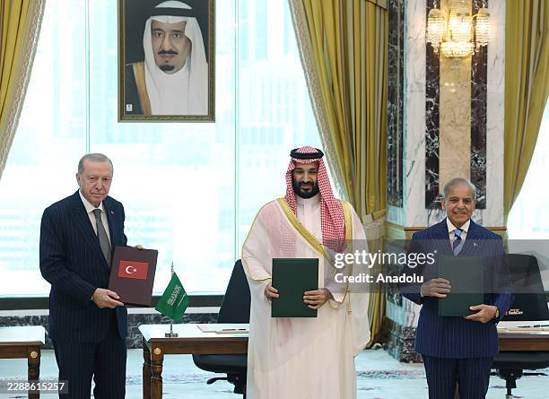 Turkish President Recep Tayyip Erdogan , Saudi Crown Prince Mohammed bin Salman and Pakistani Prime Minister Shehbaz Sharif sign a trilateral joint...