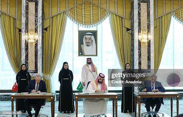 Turkish President Recep Tayyip Erdogan , Saudi Crown Prince Mohammed bin Salman , and Pakistani Prime Minister Shehbaz Sharif sign a trilateral...