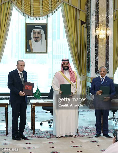 Turkish President Recep Tayyip Erdogan , Saudi Crown Prince Mohammed bin Salman , and Pakistani Prime Minister Shehbaz Sharif sign a trilateral...