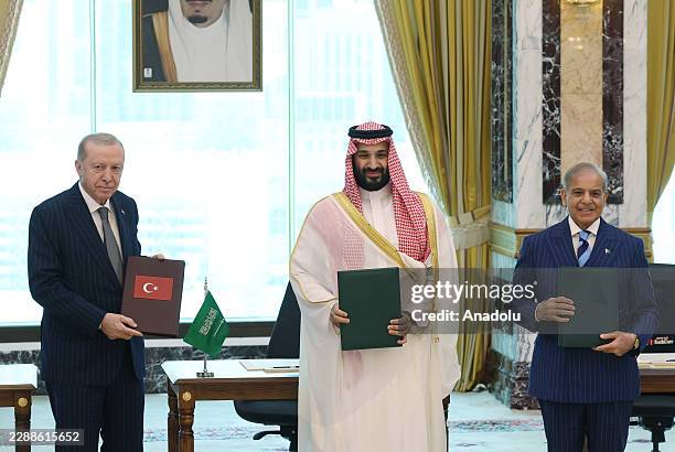 Turkish President Recep Tayyip Erdogan , Saudi Crown Prince Mohammed bin Salman and Pakistani Prime Minister Shehbaz Sharif sign a trilateral joint...