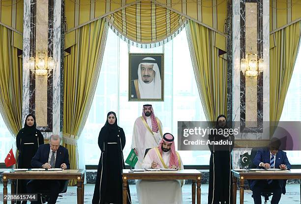 Turkish President Recep Tayyip Erdogan , Saudi Crown Prince Mohammed bin Salman , and Pakistani Prime Minister Shehbaz Sharif sign a trilateral...
