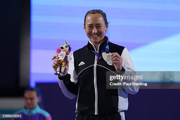 Silver medalist Tori Moorby of Team New Zealand poses for a photo during the medal ceremony for the Women's Javelin Throw Final during the Athletics...