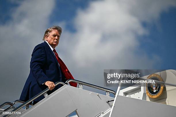 President Donald Trump boards Air Force One at Joint Base Andrews, Maryland, on August 7, 2026 as he departs for his New Jersey golf club in...