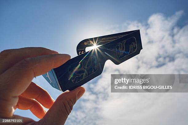 This photograph shows eclipse-viewing glasses for direct observation of the sun in Lagrasse, Southern France, on August 8 ahead of the August 12...
