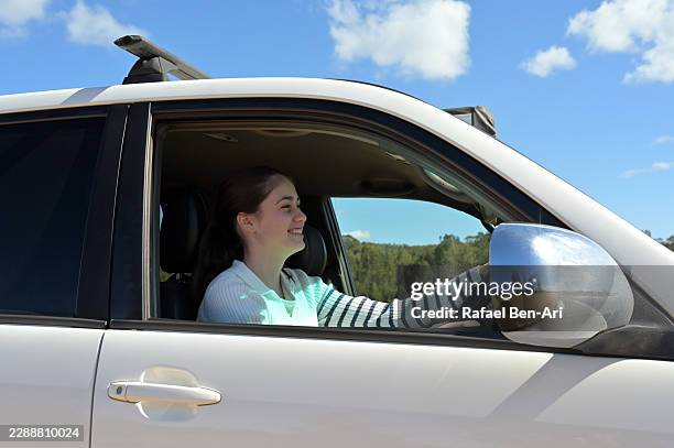 young australian learner driver focused on the road ahead - learner driver australia stock pictures, royalty-free photos & images