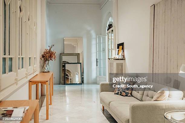 cozy vintage living room with modern decor and natural light - building entrance stock pictures, royalty-free photos & images