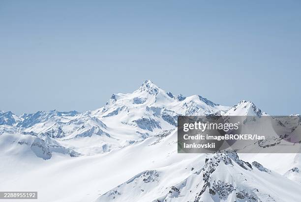 winter snow covered mountain peaks in caucasus. great place for winter sports. mount shtavler - caucasus stock pictures, royalty-free photos & images
