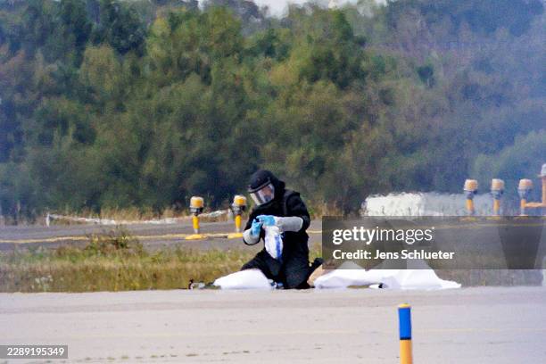 Police investigator works on the tarmac near to Ukrainian Antonov cargo plane at Leipzig/Halle Airport on August 5, 2026 near Leipzig, Germany....
