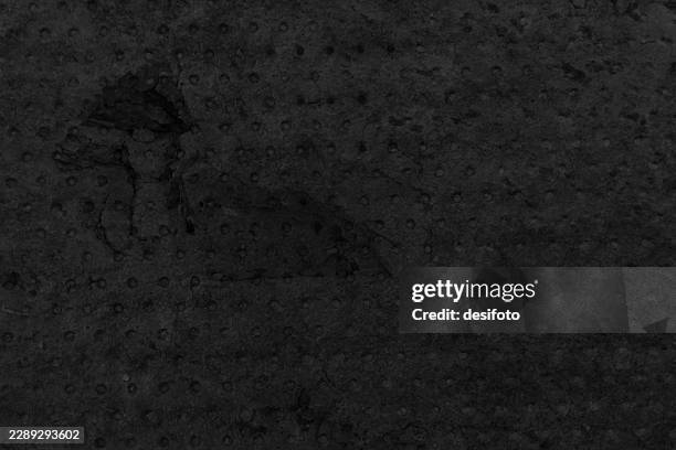 abstract spotted perforated full frame dots pattern old rough rustic concrete wall like dark gray black monochrome retro style grunge textured vector background like a rock concrete stone wall - stone wall texture stock illustrations